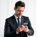 Julian Thorne, Head Curator of Luxury Gadgets, a successful man admiring a finely crafted smartphone.